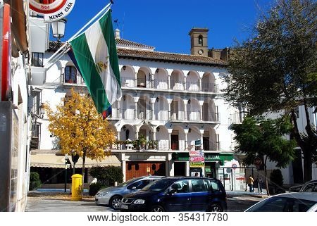 Osuna, Spain - November 13, 2008 - View Of The Plaza Mayor With An Andalucian Flag In The Foreground
