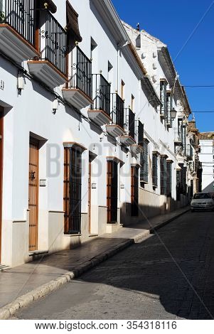Osuna, Spain - November 13, 2008 - Traditional Whitewashed Townhouses With Ornate Wrought Iron Windo