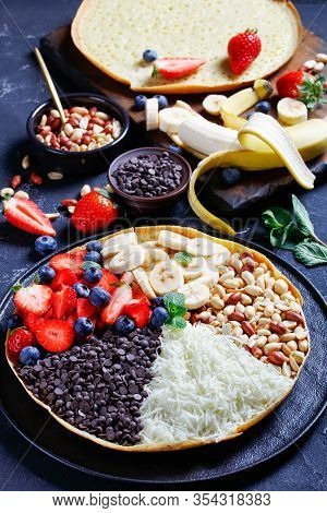 Asian Sweet Martabak Manis Or Bright Moon Pancake With Chocolate Chips, Peanuts, Strawberries, Blueb
