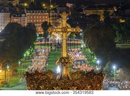 Lourdes, France - September 14 2019: Cross In Front Of The Candle Procession, Every Night In Lourdes