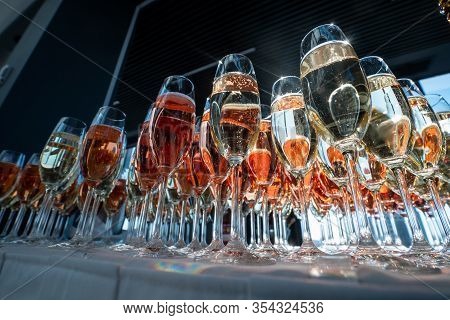 Rows Of Glasses Of Red Prosseco And Champagne