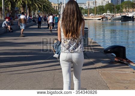 Barcelona, Spain - May 16, 2017: Unknown Young Woman Walking On The Moll De Bosch I Alsina Street In