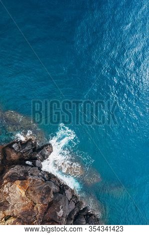 Top Aerial View Of Turquoise Atlantic Ocean Water Waves Crashing On Rocks On The Portuguese Madera I