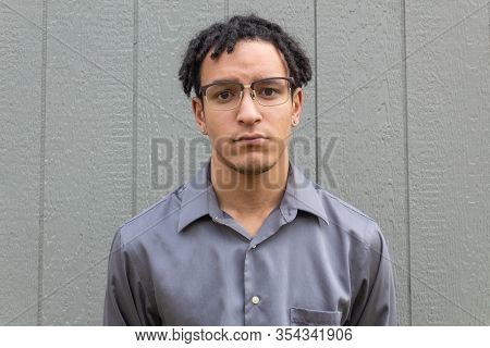 Sad Young Millennial Man Facing Forward Close View, African American Biracial Male With Natural Hair