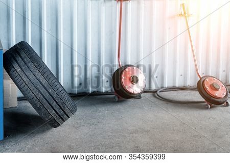 Car Wheel Repair Shop Outdoor Ground . Seasonal Winter Tyre Change At Workshop. Vehicle Tire Repair,