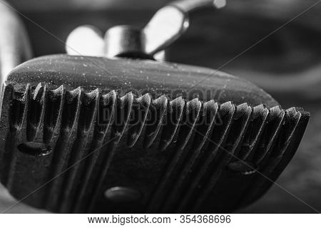 Vintage Manual Clipper. Horizontal Orientation. Wood Background. Close-up Bw