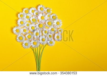 Abstract Daisy Flower Bouquet On Yellow Background