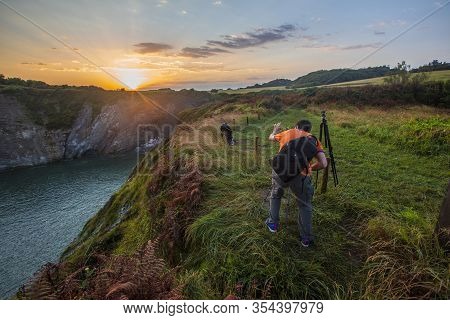 Hendaye, Lapurdi / France »; February 2018: A Photographer Photographing Just The Time Of Sunrise In