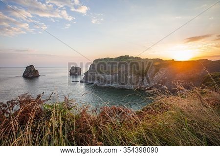 Orange Sunrise In Hendaye From The Top Of Mount On The Beach, France