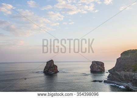 Two Sisters At The Orange Sunrise In Hendaye, France