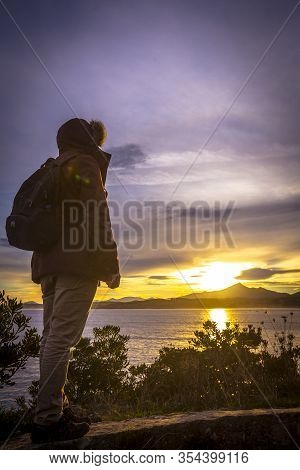 A Young Man At Dawn In The Town Of Fuenterrabia In Winter