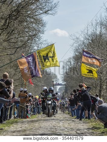 Wallers,france - April 12,2015: The Peloton Approaching Through A Crowd Of Excited Spectators On A C