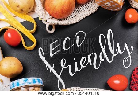 Lettering Eco Friendly, Message On A Black Chalkboard And Vegetables In A Cotton Eco Sacs And Glass 
