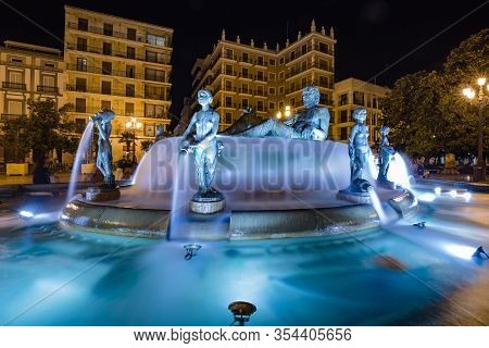 Valencia, Spain - October, 2019: Walking Night Streets Of Valencia Illuminated At Night. View Of Squ
