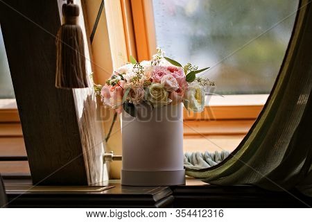 Wedding Bouquet Of The Bride In A Hatbox On The Window. Peony Rose Flowers. Pastel Colors. Close Up.