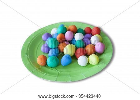 Plastic Plate Full Of Colorful Playdough Balls. Isolated Over White Background