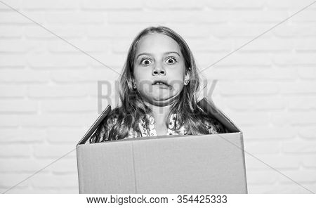 Make Moving Easier. Girl Small Child Carry Cardboard Box. Move Out Concept. Prepare For Moving. Rent