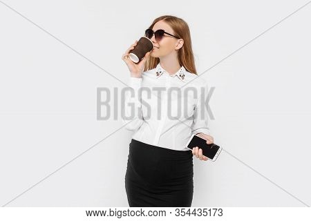 Image Of A Young Pregnant Businesswoman Wearing Glasses, A Girl Holding A Smartphone And Drinking Co