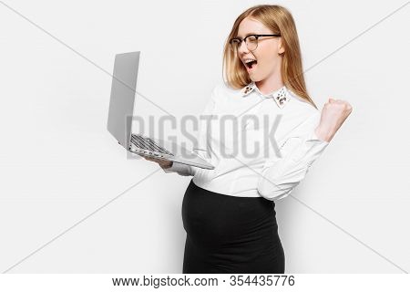 Image Of A Young Pregnant Businesswoman In Glasses Posing With A Laptop, Showing A Gesture Of Victor