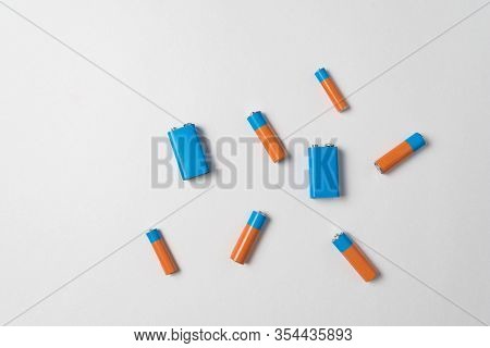 Generic Aa And Pp3 Batteries On A White Background. Different Types Of Batteries. Top View.