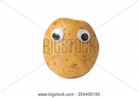 Raw Potato With Googly Eyes On Isolated White Background. Potatoes With Sad Funny Face.