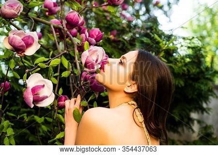 Beauty Spring Girl With Magnolia Flovers. Tenderness Sensual Woman. Passion And Sensual Touch