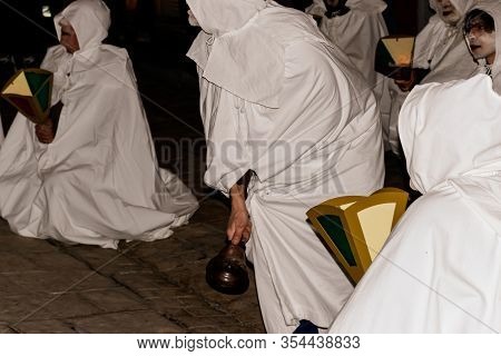 Puget-theniers, France - February 26, 2020: A Participant Ringing A Bell During The Traditional Annu