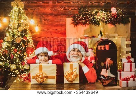 Funny Little Santa Claus Helper With Presents. Santa Helper Carrying Sack Full Of Gifts. Wish To Mee