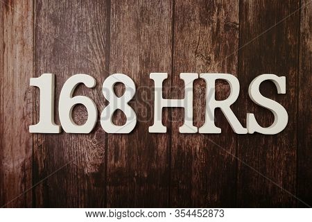 168 Hrs Number Of Hours In A Week With Space Copy On Wooden Background