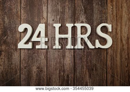 24 Hrs Alphabet Letters With Space Copy On Wooden Background