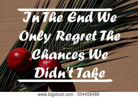 Inspirational Quote On A Natural Landscape Background. In The End We Only Regret The Chances We Didn