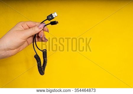 Usb Cable In Hand Close-up. Charging Your Phone