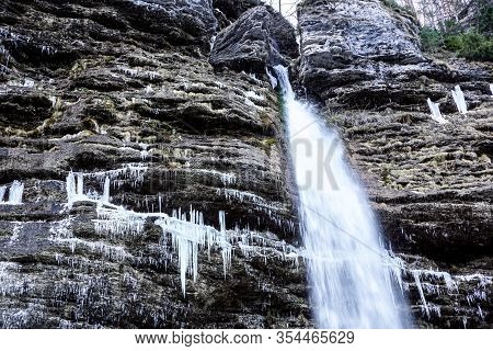 Frozen Ice Waterfall, Winter Landscape. Ephemeral, Cold And Winter Concept. Valganna Waterfall, Nort
