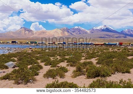 Putre, Chile - October 22, 2013: Queue Of Trucks Wait At The Chile-bolivia Border Control Point At T