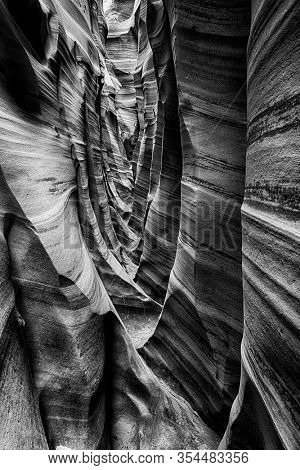 Zebra Canyon is a vivid striped and very narrow gorge. The awsome zig-zag shapes were created by water. Grand Staircase-Escalante National Monument, Utah. USA. Black and white