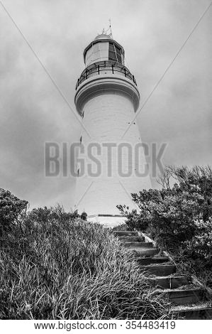 Famous Cape Otway Lightstation near the Great Ocean Road on southern coast of Victoria state, Australia. The oldest lighthouse in Australia