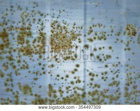 Rusty Silver Metal Texture. Corrugated Metal Is Covered With Rust Similar To Mold Spores. Corrosion