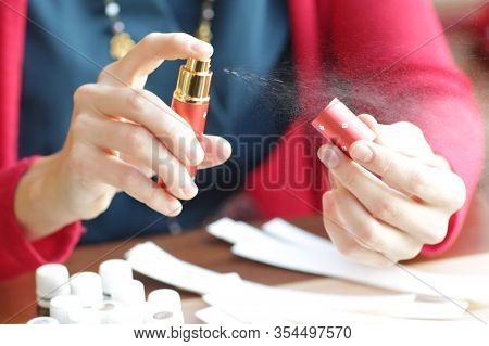 Perfumer Hand Try Aroma Oils Spray With Blotters Close Up Photo