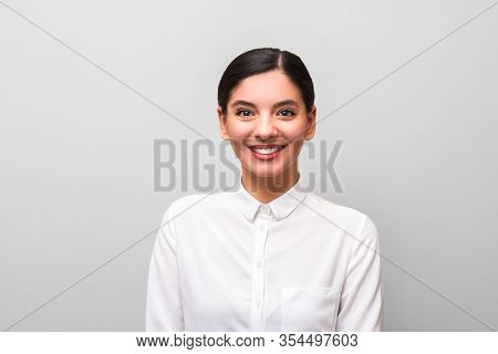 White Collar Worker Young Attractive Brunette In White Shirt With Red Lips, Business Makeup And Hair