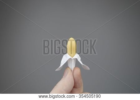 Vaginal Or Rectal Candle In Hands On A Light Background. The Drug Is In The Form Of Suppositories. T