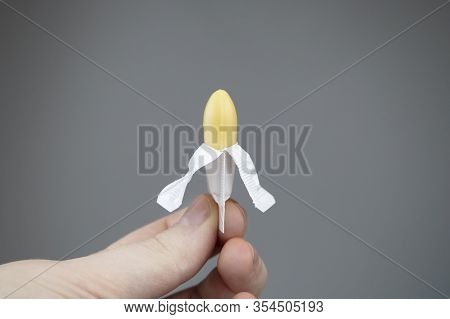 Vaginal Or Rectal Candle In Hands On A Light Background. The Drug Is In The Form Of Suppositories. T