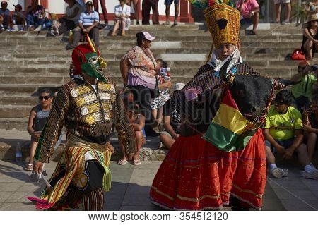 Arica, Chile - February 11, 2017: Members Of A Waca Waca Dance Group In Ornate Costume Performing At