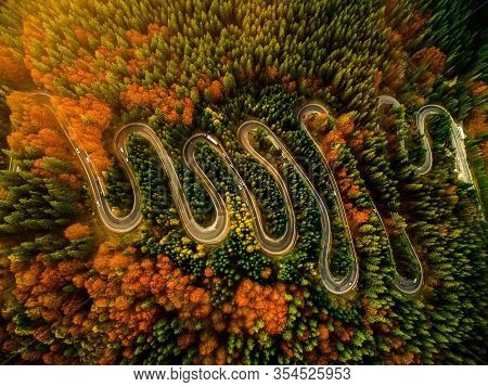 Beautiful Aerial View Of A Curvy Winding Road With Serpentine And Colorful Autumn Trees, Cheia, Dn1a