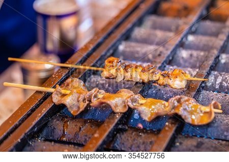Cooking Japanese Toungue Bbq Skewer On Hot Stove