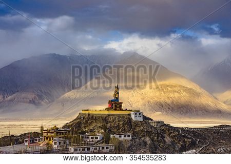 The Maitreya Buddha Statue With Himalaya Mountains In The Background From Diskit Monastery Or Diskit