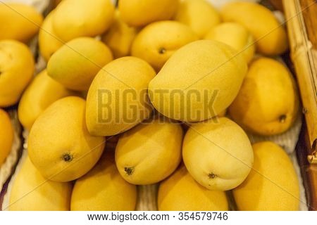 Uicy Ripe Mangoes On The Counter In The Supermarket. Close-up.