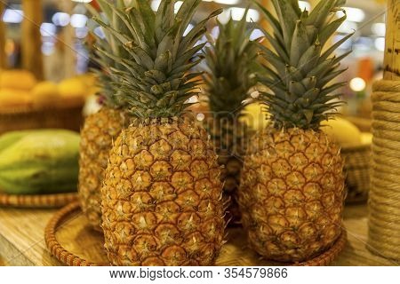 Uicy Ripe Pineapples On The Counter. Close-up.