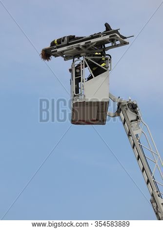 Transport The Wounded On The Platform Ladder Truck Fire Department During Evacuation Building