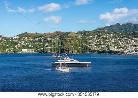 Kingstown, Saint Vincent And The Grenadines - December 19, 2018: Luxury Motor Yacht And Sailing Ship