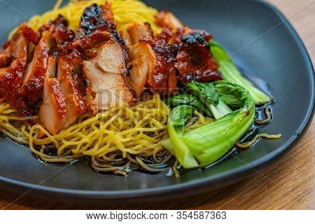 Plate Of Char Siew Noodle Served In Chinese Restaurant